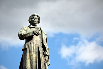 Fototapeta premium The statue of Adam Mickiewicz. Monument dedicated to Adam Mickiewicz at the Krakowskie Przedmiescie in Warsaw, Poland. Closeup view