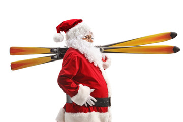 Santa Claus walking and carrying skis on shoulder