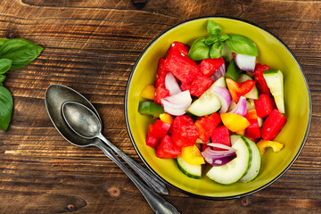 Gourmet salad with vegetables and watermelon.