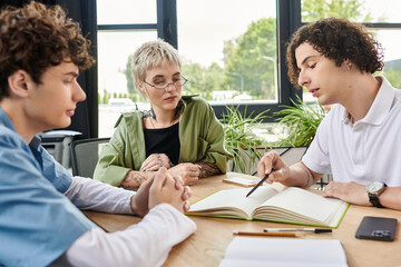 Youth collaborating in a modern office environment to brainstorm creative ideas