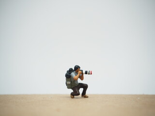 Mini toy of action figure at outdoor with blurred background. Miniature photography concept design....