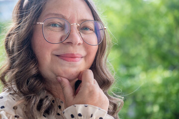vibrant, joyful woman in her 50s smiles genuinely, cheerful female joyful presence, Embracing life,...