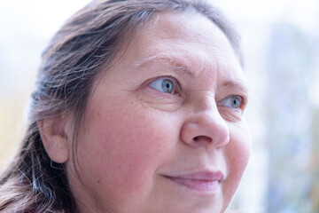vibrant, joyful woman in her 50s smiles genuinely, cheerful female joyful presence, Embracing life,...