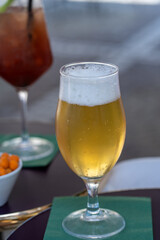 Close-Up of Cold Beer in Glass on Outdoor Table