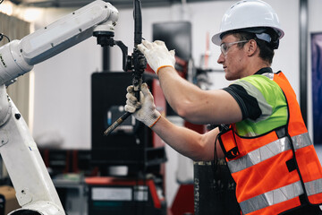 Smart Caucasian engineer work setup AI automated in robotics electronics engineering laboratory....