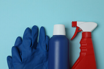 cleaning product, sponge, gloves on a blue background
