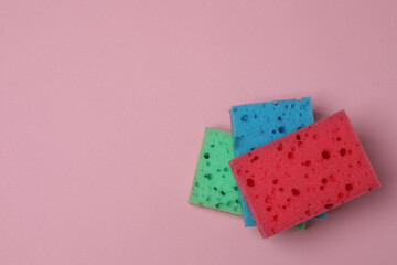 cleaning sponges on a pink background
