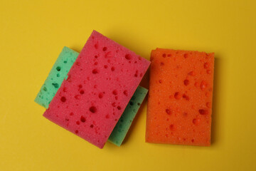 cleaning sponges on a yellow background
