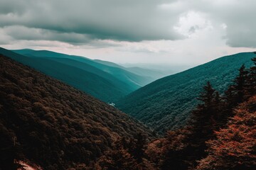 Mountain valley vista, moody sky