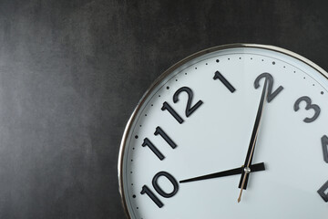 wall clock on a black background
