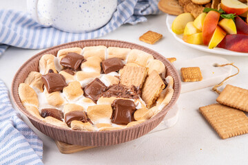 Air fryer s'mores dip with graham crackers, cookies and fruit