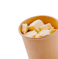 Freshly prepared dessert or cheese cubes served in a brown paper cup