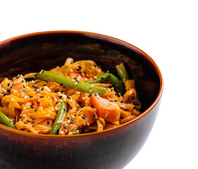 Delicious vegetable stir-fry served in a dark bowl with sesame seeds