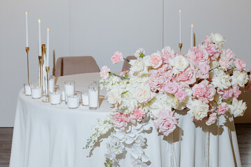 Elegant floral arrangement enhances a romantic table setting for a special celebration during an intimate evening gathering
