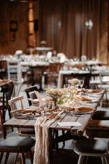 Rustic boho wedding with couple, decorations, flowers and celebration in vintage barn