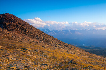 Mountain landscape with snowy peaks in the background