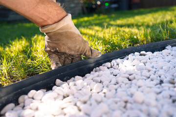 White Pebble Garden Bed with Anthracite Metal Edging and Lawn Background