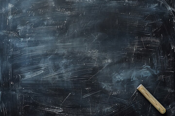 消し跡の残る黒板とシンプルな背景構図