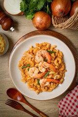Homemade Stir fried macaroni with shrimp and egg in white plate