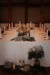 Rustic boho wedding with couple, decorations, flowers and celebration in vintage barn