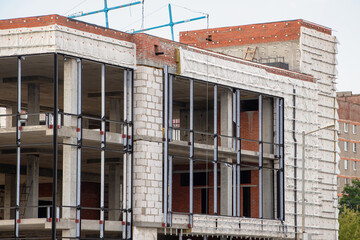 Construction progress at a modern building with exposed structur