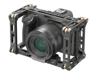 Camera rig featuring a modern DSLR/mirrorless camera housed in a metal frame