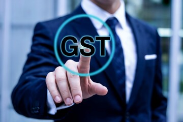 Businessman touching a glowing circle with the word gst inside, representing goods and services tax in india and its digital transformation