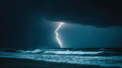Dramatic lightning bolt striking the ocean during a stormy night cloud cover
