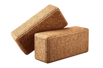 Two light brown cork yoga blocks stacked.  They are rectangular, with a slightly beveled edge and a textured surface