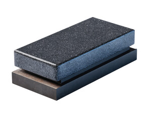 Two rectangular, dark-gray granite blocks stacked, one on top of another, resting on a metal base.  A slight bluish-gray edge highlights the top block