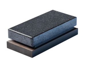 Two rectangular, dark-gray granite blocks stacked, one on top of another, resting on a metal base.  A slight bluish-gray edge highlights the top block