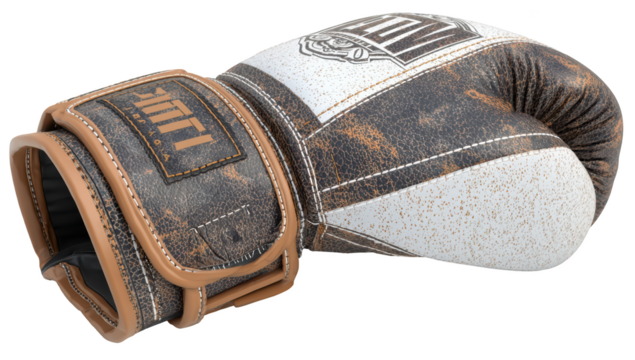 Close-up of a boxing glove, distressed leather, tan and off-white color scheme, featuring wrist wrap