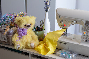 This heartwarming scene captures the essence of handmade craftsmanship, with a fluffy yellow teddy...