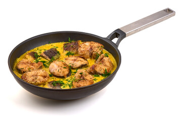 Fried fish pieces simmered in a creamy yellow sauce with dill, isolated on white background