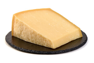 Wedge of aged Parmesan cheese on Slate Plate, isolated on white background.