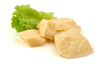 Pieces of aged Parmesan cheese on Slate Plate, isolated on white background