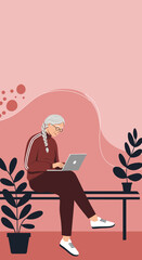 An active senior woman uses her laptop with focus, embracing technology for communication or learning in a comfortable, modern setting.