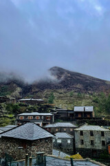 Stone houses in a misty village