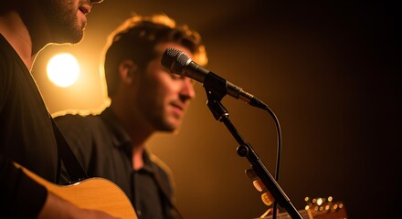 Two musicians performing with acoustic guitars and microphone