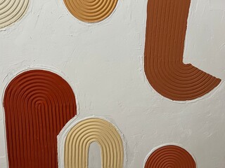 A close-up of a handmade textured 3D abstract painting with raised curved lines in orange, beige,...
