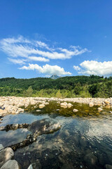 Scenery of a lake surrounded by rocks and mountains
