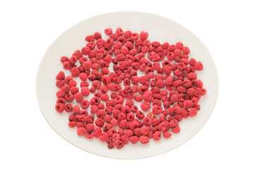 Food on the go. Nutritious snacks. Dried raspberries on a white plate isolated on a white...