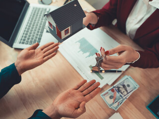 A close agent hands over the keys to the new owner or tenant, the client after signing a lease-purchase agreement, bank contract, real estate mortgage loan.