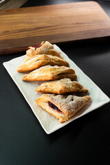 Puff pastry triangles with jam. Dessert. Pastry. Dough