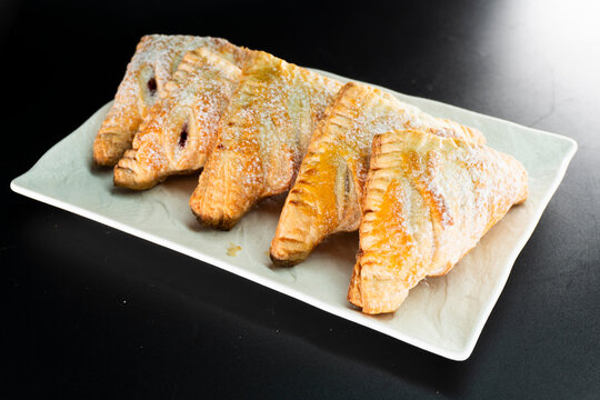 Puff pastry triangles with jam. Dessert. Pastry. Dough