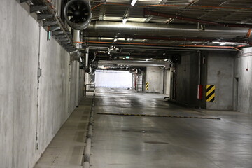 Exit from a bunker, concrete tunnel with water and ventilation installations
