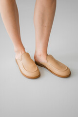 Stylish beige slipon sandals for modern comfort and versatility, perfect for casual outings or...