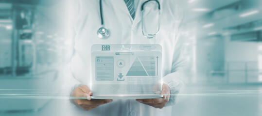 Futuristic healthcare concept showing doctor holding digital tablet with  holographic EHR...