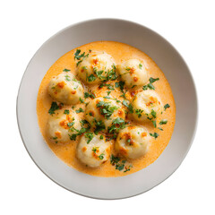 Dumpling covered with creamy sauce and parsley topping in a plate for cafe menu on transparent background. Food photography.