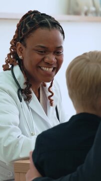 Pediatrician gently examining young patient, providing compassionate care and building trust during routine medical checkup